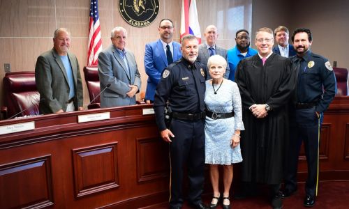 Sgt. David Bankson, Gadsden State President Dr. Kathy Murphy, Probate Judge Scott Hassell and GSCC Chief of Police Jay Freeman with the Etowah County Commission after Bankson’s swearing-in.