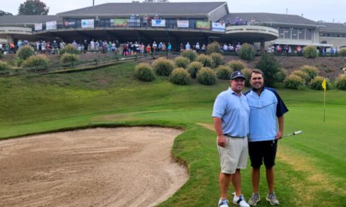 Teammates Garrett Burgess (left) and Taylor McCullum celebrate Sunday at Anniston Country Club, after winning the 45th Sunny King Charity Classic. (Photo by Joe Medley)