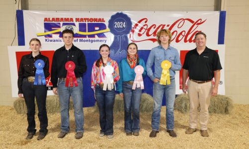 Senior Showmanship winners in the Youth Swine Show at the Alabama National Fair Oct. 13 in Montgomery were, from left, Madelyne Tallent of Calhoun County, champion; Tucker Ross of Jefferson County, reserve champion; Alyx Johnson of Randolph County; third place; Anna-Brook DeLoach of St. Clair County, fourth place; and Dalton Fink of Calhoun County, fifth place. Senior Showmanship is for exhibitors ages 16-19. Alabama Farmers Federation and Alfa Insurance sponsored youth livestock events at the fair. Winners are pictured with Federation Executive Director Paul Pinyan, right.