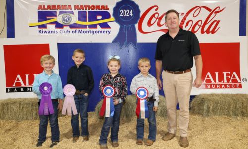 Beginner Premier Exhibitor winners in the Youth Swine Show at the Alabama National Fair Oct. 13 in Montgomery were, from left, Seth McMurray of Lee County, grand champion; Roop Lovvorn of Randolph County, reserve champion; Ella Hopper of Randolph County; third place; (not pictured) Laina Chestnut of Barbour County, fourth place; and Carter Payne of Randolph County, fifth place. Beginner Premier Exhibitor is for exhibitors ages 4-8 and consists of showmanship, livestock evaluation and a written test. Alabama Farmers Federation and Alfa Insurance sponsored youth livestock events at the fair. Winners are pictured with Federation Executive Director Paul Pinyan.