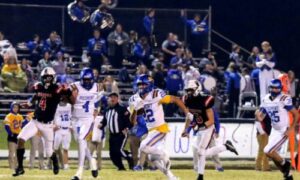 Piedmont’s Rollie Pinto breaks a 73-yard touchdown run that put Piedmont ahead in the fourth quarter, and the Bulldogs held off Weaver 26-21 on Friday, (Photo by Greg Warren/For East Alabama Sports Today)