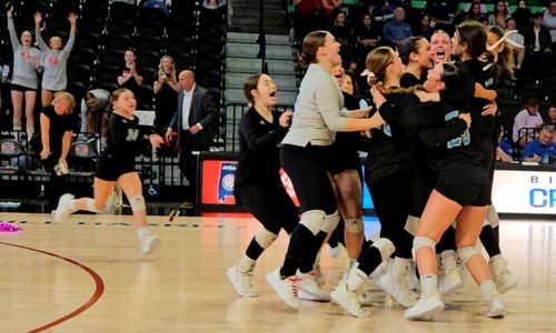 Pleasant Valley players celebrate after clinching the Raiders’ second consecutive state title and seventh overall Wednesday in Birmingham’s Bill Harris Arena. (Photo by Joe Medley)