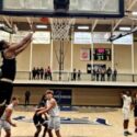 Oxford’s Jayden Lewis goes up for an alleyoop pass from from Jaylen Alexander during the Yellow Jackets’ 80-48 victory at Jacksonville on Monday. (Photo by Joe Medley)