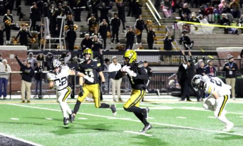 Oxford’s Jaylin Taylor heads to the end zone with one of his four touchdown catches Friday, and the Yellow Jackets beat Fort Payne 28-26 to reach the Class 6A semifinals. (Photo by Greg Warren/For East Alabama Sports Today)