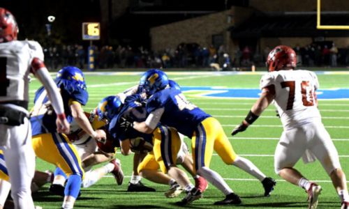 Piedmont’s Kale Austin leads the charge of Bulldog defenders who stopped Fyffe’s two-point conversion attempt in overtime on Friday. (Photo by Ken Grissom/For East Alabama Sports Today)