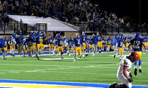 Piedmont players rush the field after clinching their Class 3A quarterfinal victory over Fyffe on Friday. (Photo by Ken Grissom/For East Alabama Sports Today)