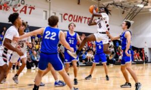 Weaver’s D.J. Marbury drives the lane against White Plains on Friday at Weaver. (Photo by Brad Campbell/For East Alabama Sports Today)