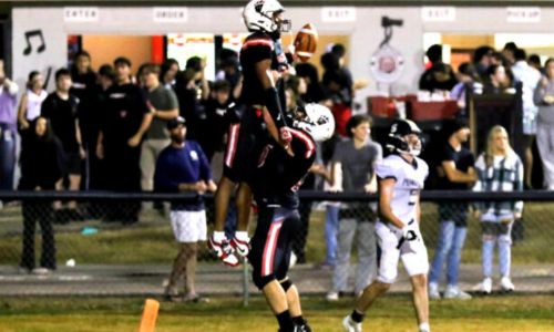 Weaver’s KeShawn Allen celebrates after catching a touchdown pass against J.B. Pennington on Friday at Weaver. (Photo by Greg Warren/For East Alabama Sports Today)