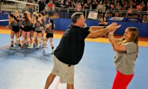 Ohatchee head coach Rebecca Hughes and assistant coach Ronnie Henderson celebrate as their players celebrate after winning a five-set Class 3A semifinal against St. Luke’s on Wednesday at Birmingham CrossPlex. (Photo by Joe Medley)