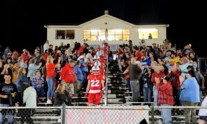 Pleasant Valley’s football players file down the home grandstand just before kickoff for their first home playoff game in 40 years on Friday. (Photo by Joe Medley)