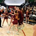 Spring Garden coach Ricky Austin hands the school’s latest state–title trophy in volleyball to his team following their victory over University Charter in Thursday’s Class 1A final in Birmingham’s Bill Harris Arena. (Photo by Joe Medley)