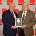 Rick Pate, right, of Lowndes County receives the Alabama Farmers Federation’s Service to Agriculture Award during its 103rd annual meeting in Montgomery. Federation President Jimmy Parnell presented the award in recognition of Pate’s transformative contributions as commissioner of the Alabama Department of Agriculture & Industries.