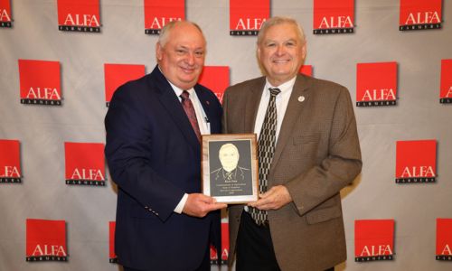 Rick Pate, right, of Lowndes County receives the Alabama Farmers Federation’s Service to Agriculture Award during its 103rd annual meeting in Montgomery. Federation President Jimmy Parnell presented the award in recognition of Pate’s transformative contributions as commissioner of the Alabama Department of Agriculture & Industries.