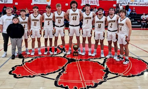 Spring Garden’s boys celebrate after winning the Heflin Holiday Hoops Classic on Saturday. (Photo by Joe Medley/East Alabama Sports Today)