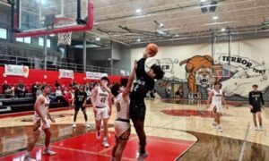 Weaver’s Junior Allen goes to the basket against Spring Garden during Thursday’s action in the Heflin Holiday Hoops Classic. (Photo by Joe Medley)