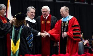 Alabama Speaker of the House Nathaniel Ledbetter (center) is awarded an Honorary Doctorate of Letters by Jacksonville State University President Dr. Don C. Killingsworth, Jr., as (from left) Trustee Randy Owen, Provost and Executive Vice President for Academic Affairs Dr. Christie Shelton, and Board of Trustees Chairman Randy Jones look on. The honor was bestowed during Jax State’s fall commencement ceremony on December 13, 2024, at Pete Mathews Coliseum. (JSU Photo by Alyssa Cash)