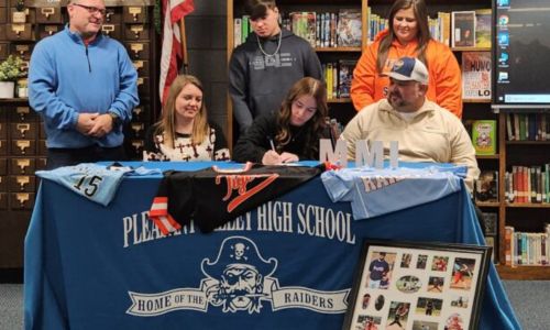 Pleasant Valley softball standout Haylie Lee celebrates her signing with Marion Military Institute during Wednesday’s ceremony in the Pleasant Valley school library, (Photo by Joe Medley)