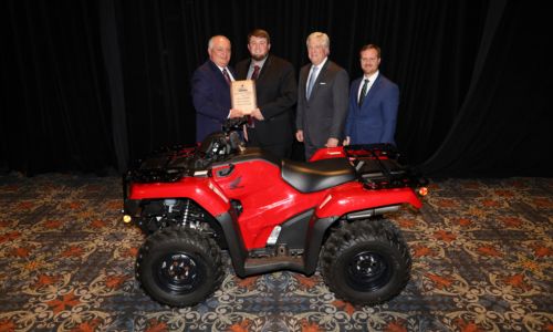 Levi Noles of Randolph County won the statewide Discussion Meet contest during the Alabama Farmers Federation’s 103rd annual meeting in Montgomery Dec. 9. From left are Federation President Jimmy Parnell; Noles; First South Farm Credit’s John Sport; and Federation Young Farmers Division Director Hunter McBrayer.