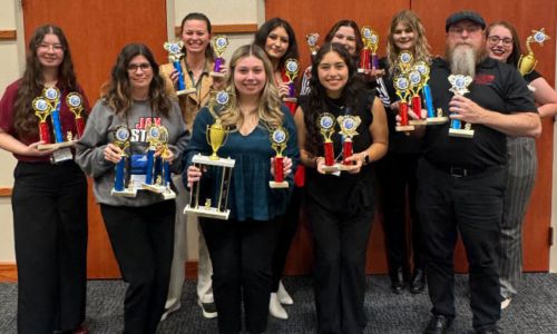 Members of Lambda Alpha Epsilon and their awards from the regional conference. (Photo Courtesy of JSU)