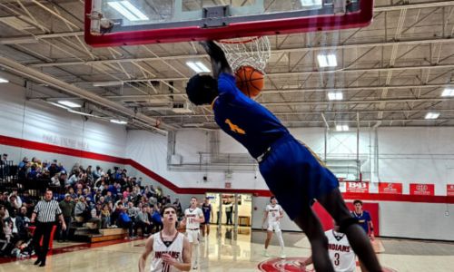 Piedmont’s Ishmael Bethel finishes off one of his three dunks at Ohatchee on Thursday. (Photo by Joe Medley/East Alabama Sports Today)