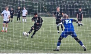 Oxford’s Joseph Bartolon blasts a penalty kick against White Plains during Thursday’s Calhoun County championship match at Choccolocco Park. (Photo by Joe Medley/East Alabama Sports Today)