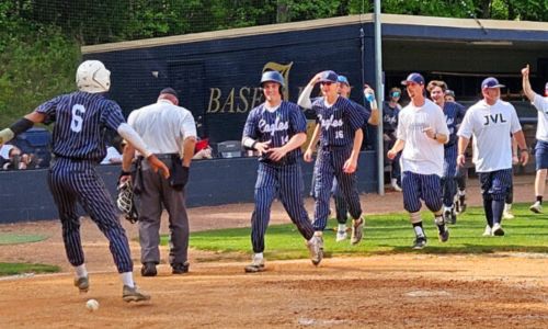 Jacksonville players celebrate Saturday after Xaye Lemon scored the walk-off run in the fifth inning of Game 3 of the their first-round Class 5A playoff series against John Carroll Catholic. (Photo by Joe Medley/East Alabama Sports Today)