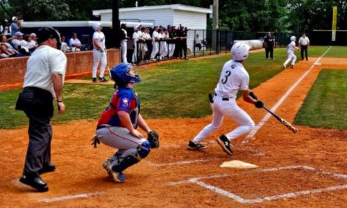 Hope Christian’s Eli Bozeman watches the flight of his two-run double in the first inning of the Saints’ AISA quarterfinal series with South Choctaw on Tuesday at Oxford’s Big Jack Stovall Sports Complex.