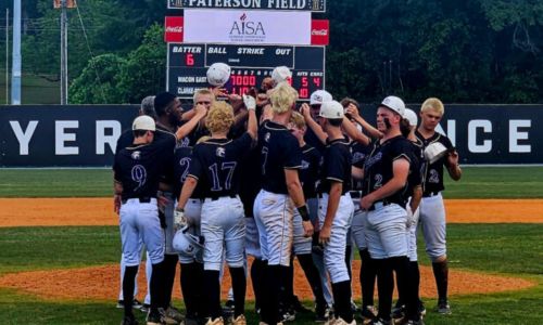 Hope Christian players and coaches huddle at the pitcher’s mound at Montgomery’s Paterson Field after Wednesday’s Game 3 of their Class A AISA semifinal series with Patrician. (Photo by Joe Medley/East Alabama Sports Today)