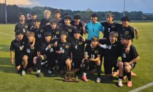 Oxford’s boys’ soccer team celebrates after winning the Calhoun County Tournament. The Yellow Jackets beat Pinson Valley in a first-round playoff match on Thursday. (Photo by Joe Medley/East Alabama Sports Today)