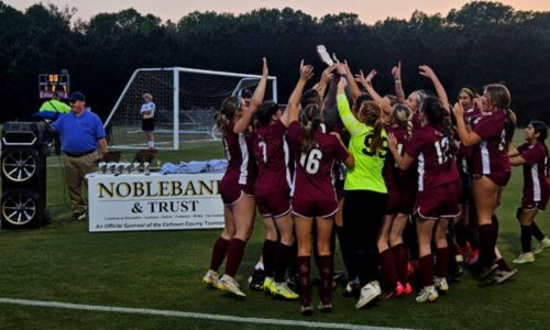 Donoho’s girls claim their latest Calhoun County soccer championship trophy Thursday at Choccolocco Park. (Photo by Joe Medley/East Alabama Sports Today)