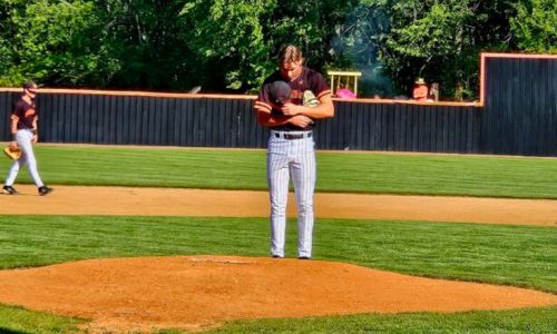Alexandria’s Bray Goode prays before pitching against Dora in last week’s first-round playoff series. The AHSAA second round and AISA quarterfinals are this week. (Photo by Joe Medley/East Alabama Sports Today)