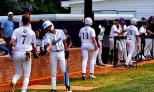 Hope Christian’s Easten Strickland celebrates with Kainen Bozeman after Eli Bozeman’s two-run double in the first inning of the Saints’ AISA quarterfinal series with South Choctaw on Tuesday at Oxford’s Big Jack Stovall Sports Complex. Hope plays Patrician in the AISA semifinals Monday at Montgomery. (Photo by Joe Medley/East Alabama Sports Today)