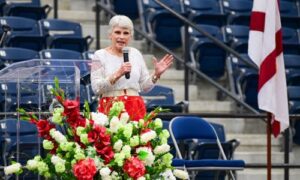 resident Kathy Murphy addresses faculty and staff at convocation in February 2025.
