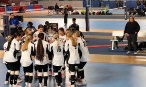 Long-time Wellborn coach Brenda Vinson watches her team huddle during the state volleyball tournament. She’s retiring after 24 years as a varsity head coach, with stints in four different sports. (Submitted photo)