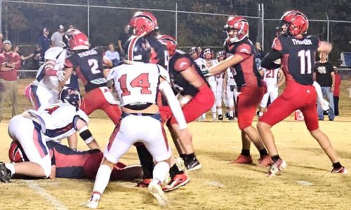 Jacksonville Christian&rsquo;s Noah Lee looks for a receiver against Cornerstone-Rainsville during last season&rsquo;s Alabama Christian Athletics Association semifinal game at JCA. He announced Tuesday his commitment to Jax State. (Photo by Joe Medley)