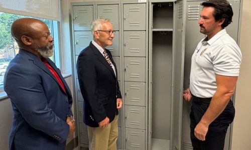 hief Jay Freeman shows the Cardinal Foundation leadership the new evidence lockers at the Wallace Drive campus.