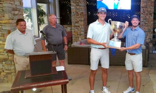 Harrison Hughston (center) and Jacob LeCroy (right) hoist the championship trophy for the 46th annual Sunny King Charity Classic on Sunday at Anniston Country Club. (Photo by Joe Medley/East Alabama Sports Today)