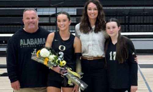 Payton Brooks (second from left) joins father Roby Brooks, mother Melanie Brooks and sister Molly Brooks during Tuesday’s ceremony to mark the senior setter’s recent career milestone. Payton Brooks surpassed 4,000 career assists Sept. 18.