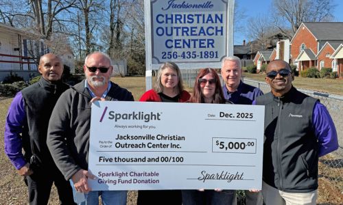 $5,000 Charitable Giving Fund grant (with a “big check”) to the Jacksonville Christian Outreach Cente