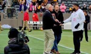 Rico Jackson accepts the AHSAA’s state-runnerup trophy after Anniston fell to Jackson in the Class 4A state final on Dec. 5 in Birmingham. (Photo by Joe Medley/East Alabama Sports Today)