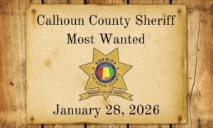 photo of old west paper with most wanted on it with the sheriff's office on a wood background