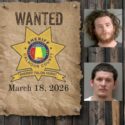Most wanted poster with sheriff star nailed to a wood plank wall with 4 mugshots of wanted people