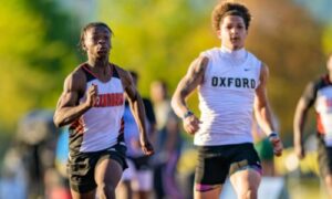 Oxford’s Kamari English and Alexandria’s T.J. Crook compete in the 200-merer prelims Tuesday at Choccolocco Park. Oxford’s boys lead the Calhoun County track meet after the first day, and Alexandria’s girls hold a slim led. The county championships conclude Wednesday at Choccolocco Park. (Photo by Brad Campbell/sport-shutter.com)