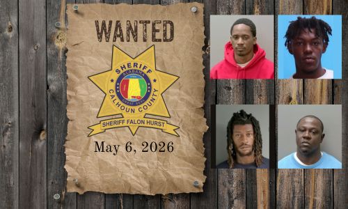 Wanted photo with 4 mugshots on old west wood planked wall with wanted poster and Sheriff's Office star