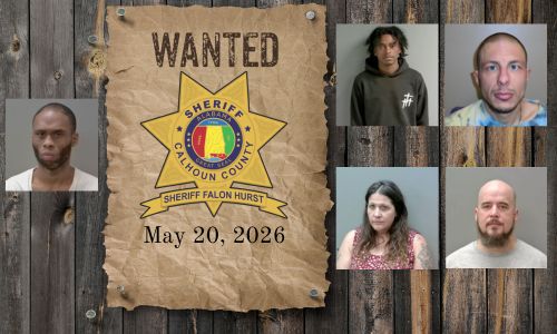 Wanted photo with 5 mugshots on old west wood planked wall with wanted poster and Sheriff's Office star