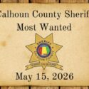 Old west parchment with Calhoun County Sheriff Most Wanted words and Sheriff Star
