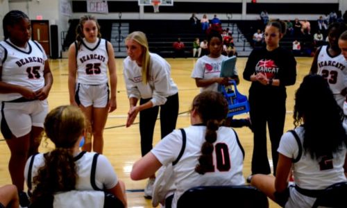 Amanda Noah gives a timeout talk during basketball season. She’ll continue to coach varsity girls’ basktball while adding varsity volleyball to her responsibilities at Weaver. (Submittd photo)