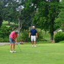 Andrew Brooks putts on No. 16 as (from left) Ted Gregerson, Jeremy McGatha and Aaron Gregerson watch during Friday’s play in the Wilfred Galbraith Invitational at Anniston Country Club. (Photo by Joe Medley/East Alabama Sports Today)