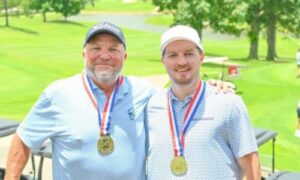 Lewis LeCroy (left) and Jacob LeCroy celebrate Tuesday after winning the AGA Father-Son Championship in Birmingham. (Submitted picture)