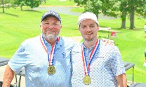 Lewis LeCroy (left) and Jacob LeCroy celebrate Tuesday after winning the AGA Father-Son Championship in Birmingham. (Submitted picture)